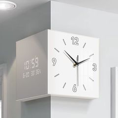 現代のシンプルなリビングルームの両面の角の掛け時計のクリーム風は穴を開けないで家庭用の創意的な時計の壁の明かりの時計は絵を掛けます。