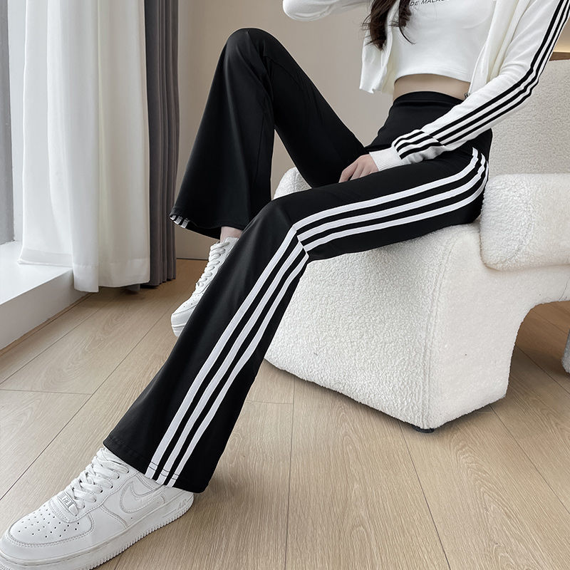 Micro speaker shark pants for women with high waist and slimming effect, 2023 new side white stripe spring and autumn black popular horseshoe leggings