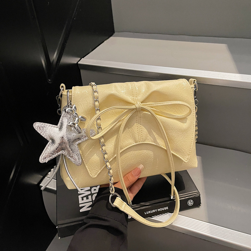 Versión coreana del bolso de cadena de nicho 2025 verano nuevo bolso femenino moda bowknot bandolera de textura de alta calidad