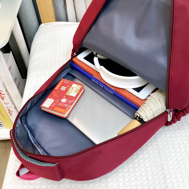 Mochila transfronteriza mayorista de estudiantes de secundaria y secundaria mochila de gran capacidad de ocio pequeña fresca de color reducción de carga mochila de viaje