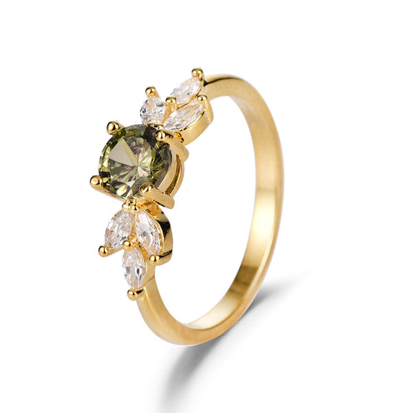 Golden ring with zircon