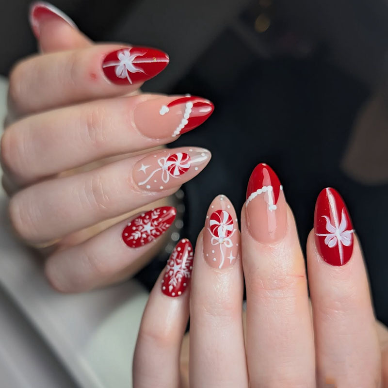 Christmas manicure medium almond nails, red French nails, snowflakes, bows, candy, Christmas hats, autumn and winter nail pieces Christmas manicure medium almond nails, red French nails, snowflakes, bows, candy, Christmas hats, autumn and winter nail pieces