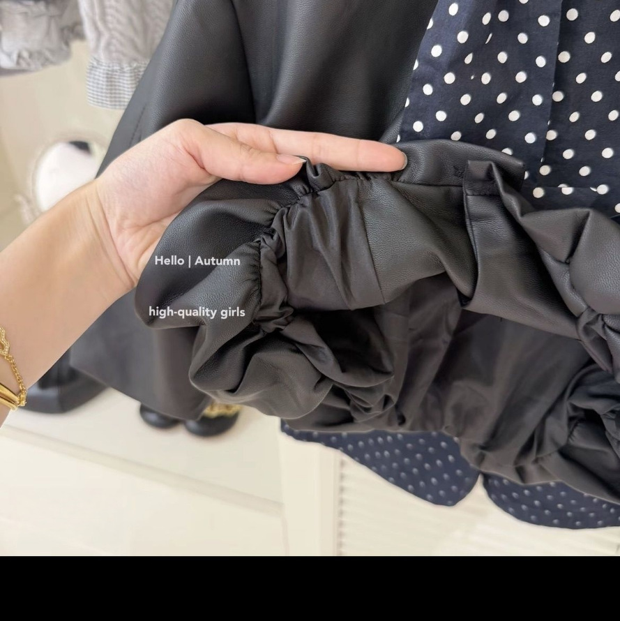 Diseño original para niñas otoño y invierno 2025 abrigo de cuero negro corto exterior abrigo de bebé elegante
