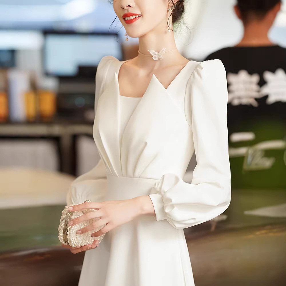 白色晚礼服女2023新款宴会气质连衣裙缎面主持人长袖法式领证订婚