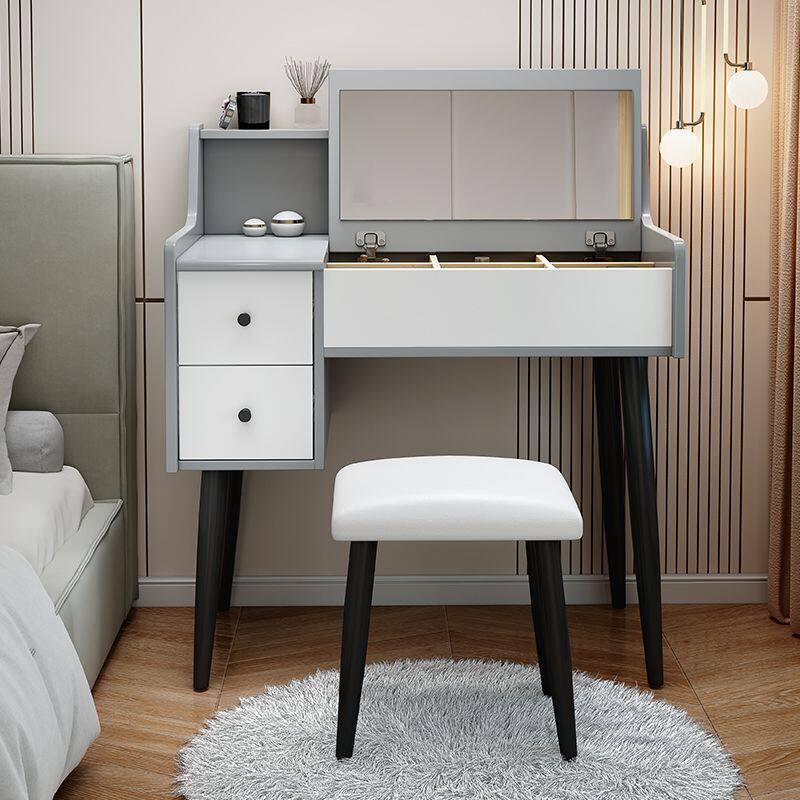 Comodador de dormitorio moderno y simple espejo de casa pequeña puede ocultarse tipo plegable con escritorio de lámpara en una mesa de maquillaje