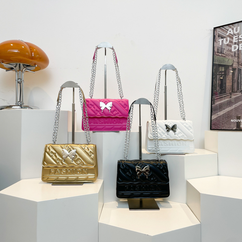 Casual simple color sólido moda 2025 nueva cadena de moda diamante hombro de mano bolso pequeño para mujeres