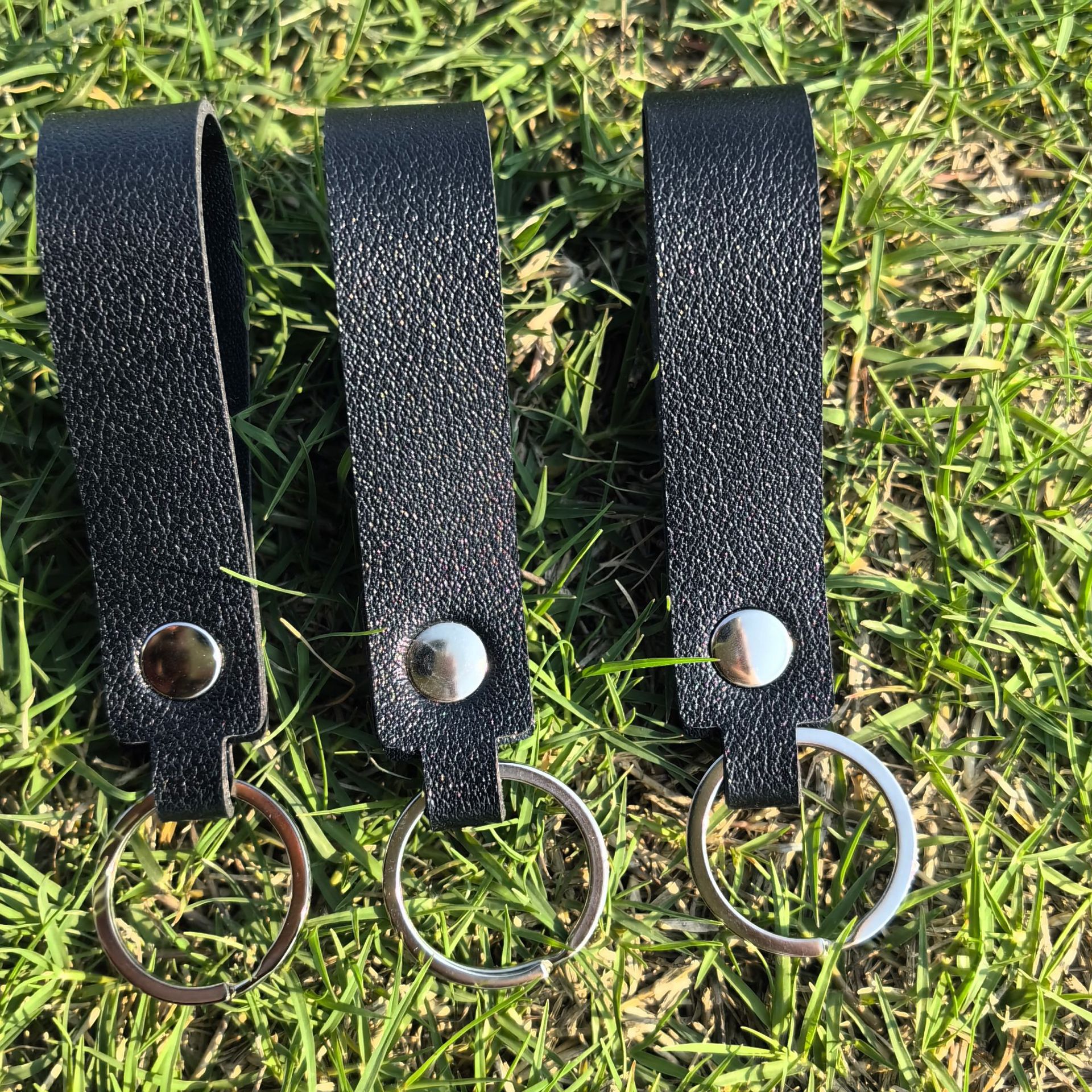 Clavera de cuero de doble cara colgante accesorios accesorios de bolsas accesorios de tendencia simple llavera de automóviles accesorios