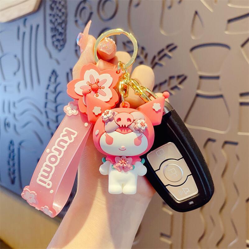 ピンクの桜のサンリオの公仔の玉桂の犬のキーホルダーはかわいい漫画のペンダントの自動車のキーホルダーの卸売りを掛けます。|undefined