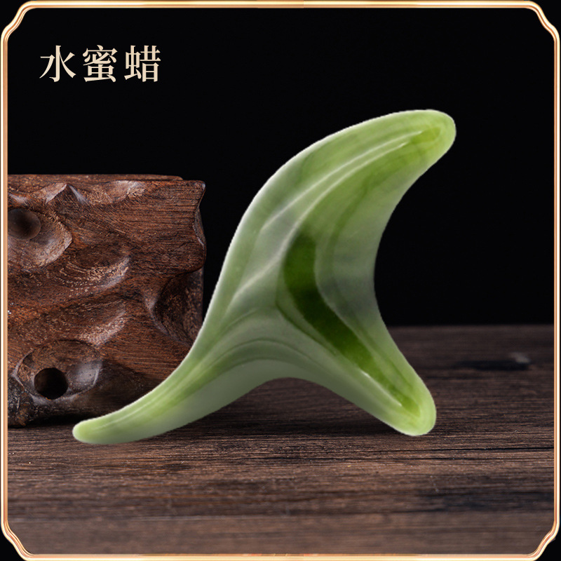 檀木の三角すずめのマッサージ器の蜜ろうの香木の筋の経絡の錐は足の底のツボの足を押してマッサージして穴の棒をつけます。