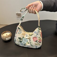 クロスボーダーの新型キャンバスの脇の下に大容量の小衆の文芸のショルダーバッグのファッション的な花の美しい条の絨毯の新月の包みを包みます。
