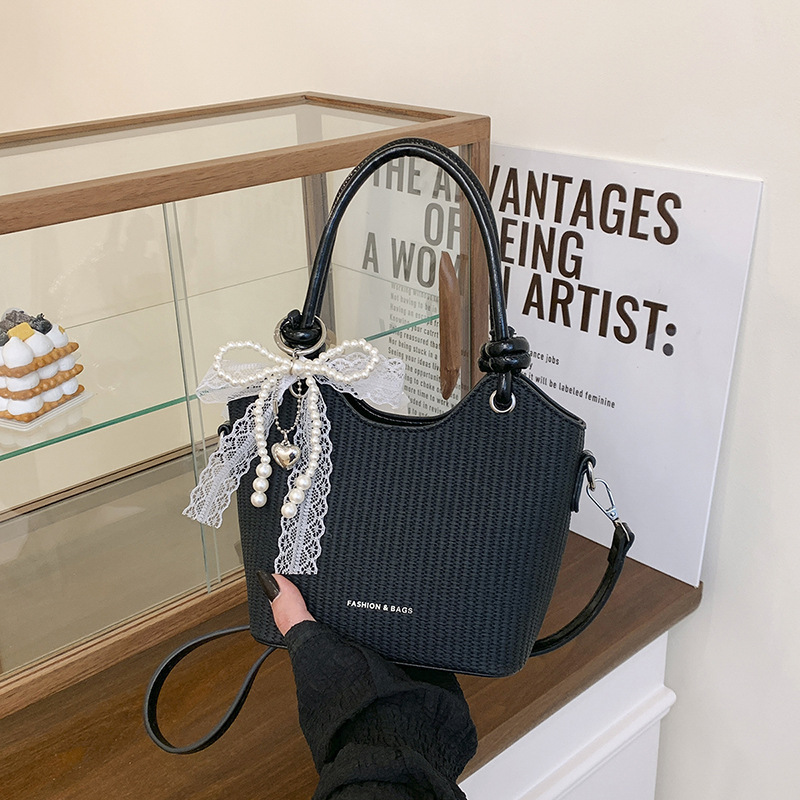 Bolsos de alta gama para mujer 2025 nuevo bolso de cubo popular moda bolso de hombro de todo fósforo bolso de mensajero de cercanías