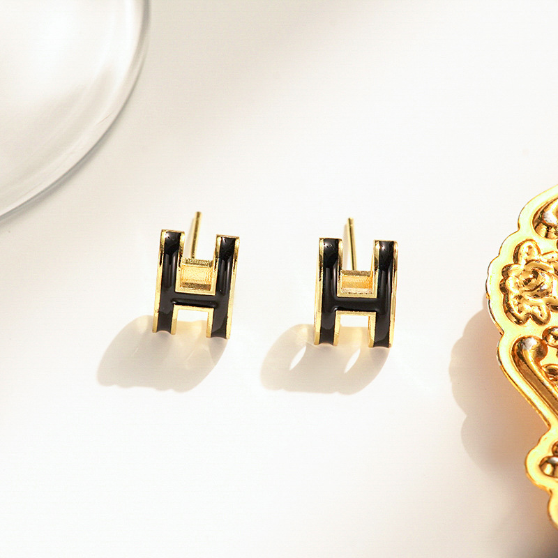 Gold and black earrings