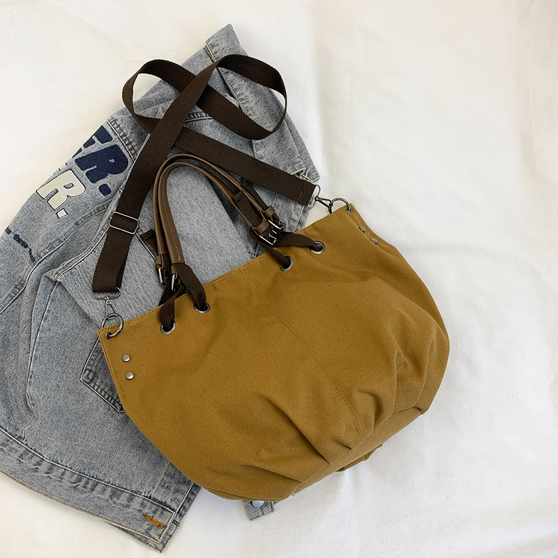 Este año popular universal nicho japonés VW lienzo de gran capacidad 2024 estilo de estilo occidental retro portátil clase de viaje mochila