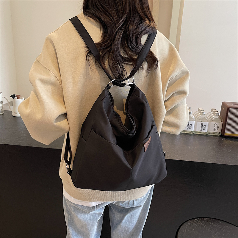Nueva mochila multifuncional para mujer, bolso de viaje de textura de moda, bolso de mensajero, mochila de nailon de gran capacidad, bolso de hombro