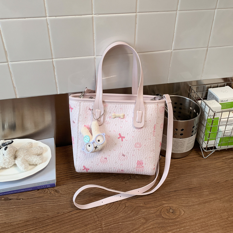 Fresco dulce popular impresión bolsos personalidad extranjera versátil bolsos de mochila de moda diaria bolsos de cubo portátiles