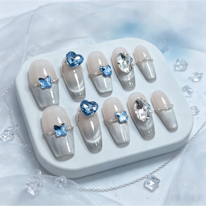 French-style cat-eye sea blue rhinestone manicure with butterfly gradient, purely handmade wearable nails, sweet and alluring, with an ice-clear finish French-style cat-eye sea blue rhinestone manicure with butterfly gradient, purely handmade wearable nails, sweet and alluring, with an ice-clear finish