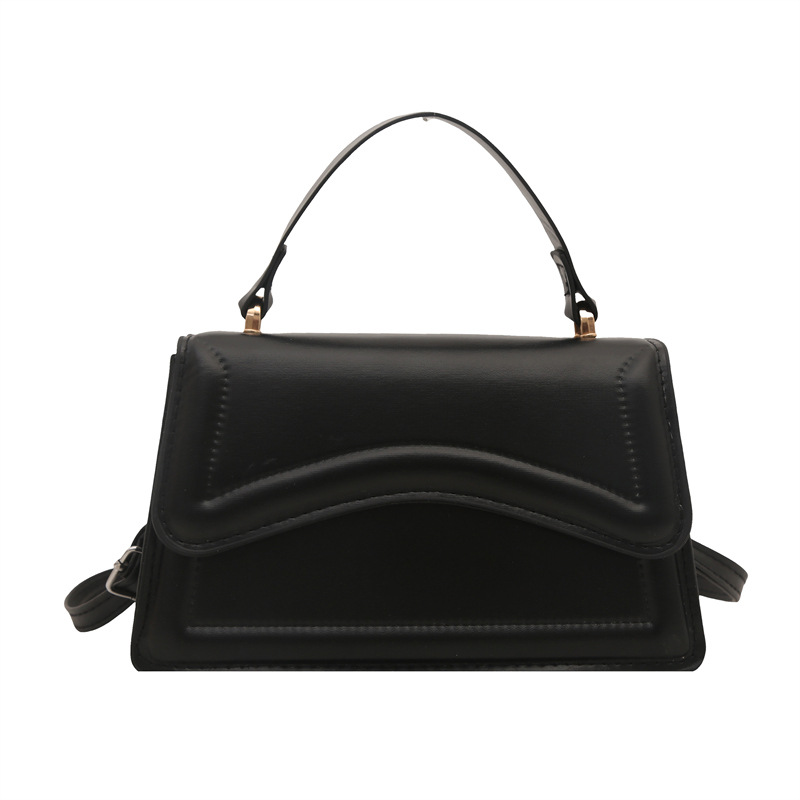 Texturas de moda en estilo de estilo de viaje ocio personalidad de primavera 2025 nuevo bolso de mano minimalista nicho bolso de mochila