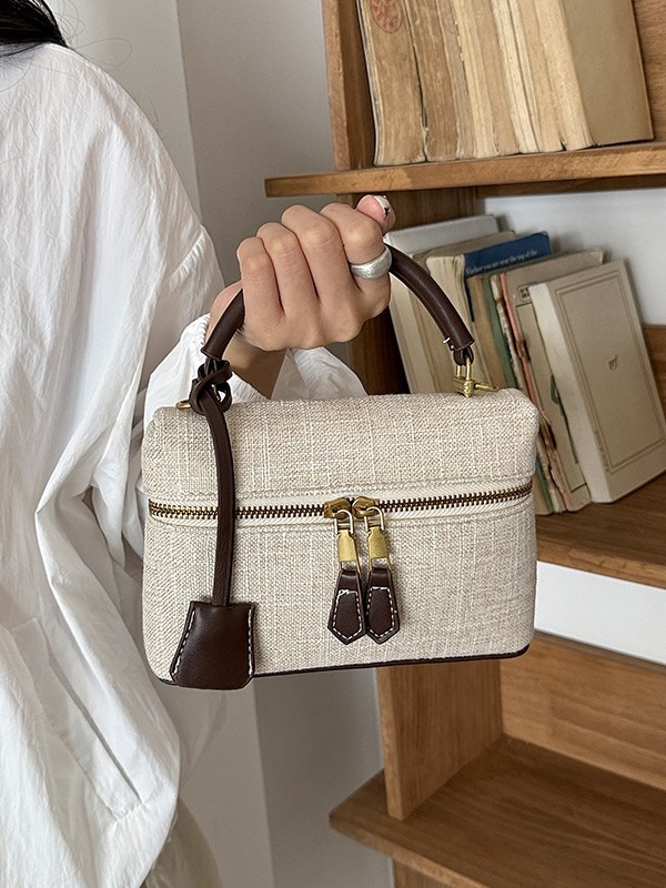 Bolso de mano de alta sensación para mujeres 2026 nuevo nicho zhong lino bolsa de almuerzo de viaje transfronterizo mochila pequeña bolsa