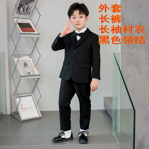 Black jacket, trousers, shirt, vest, bow tie