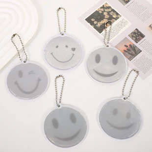 Двусторонние светоотражающие брелоки PVC со смайлом