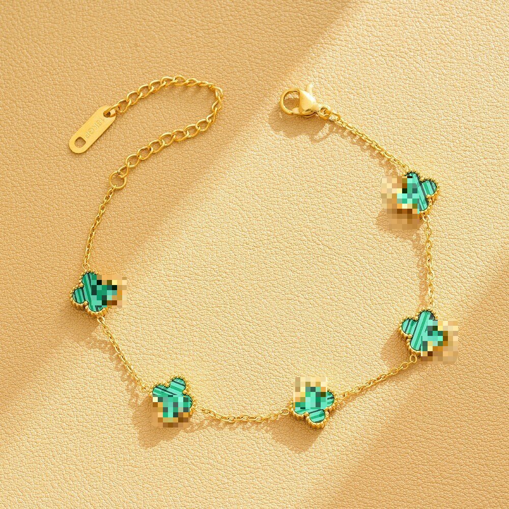 Pulsera de trébol de acero titanium vendedora caliente transfronteriza europea y americana con incrustaciones de concha pulsera colgante pulsera de diseño avanzado sin desvanecimiento al por mayor