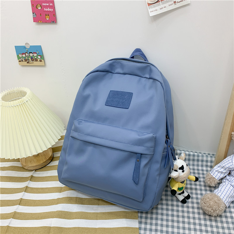 2024 新しいシンプルなバックパックナイロン韓国語バージョン中高生通学日本のキャンパススタイルのバックパック卸売
