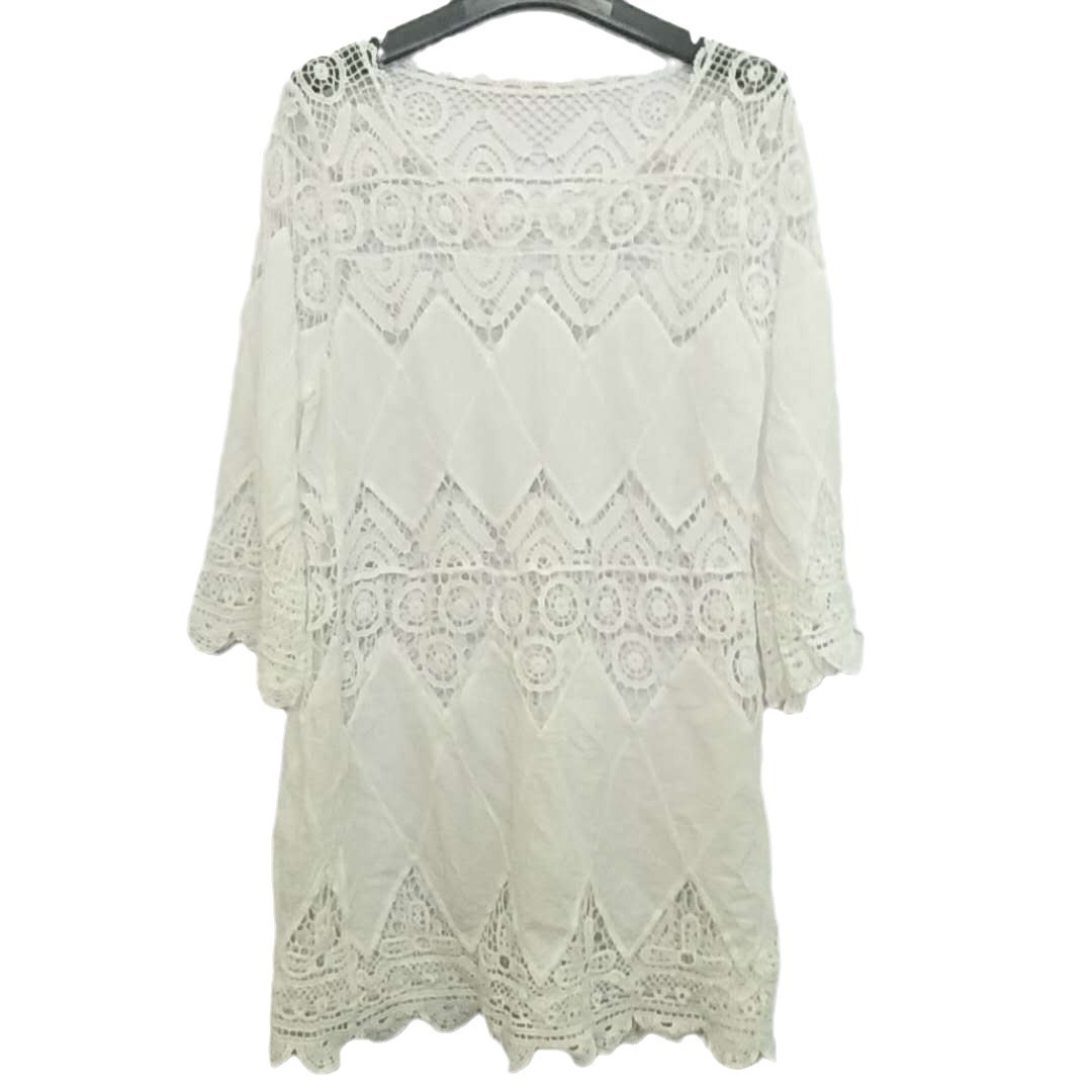 Europa y América nuevo hueco de ganchillo parche bordado playa bikini blusa playa vestido