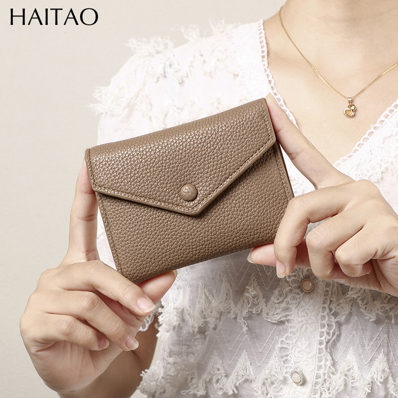 Cartera de mujer corta simple cartera plegable de tres pliegues japonesa y coreana de moda nuevo sobre bolso de cambio transfronterizo
