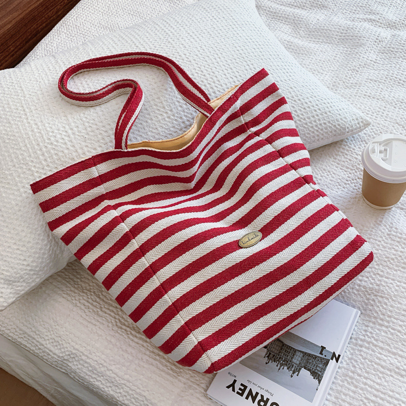Bolsas de lona a rayas de doble cara nicho de mujeres coreanas de gran capacidad perezosa bolsas de compras de ocio de estudiantes