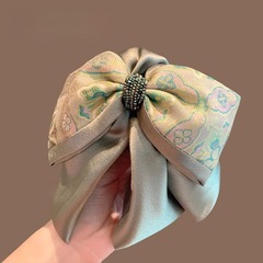 新中国風の国風刺繍の蝶結びの馬尾は精致な後頭部を挟んで半分に髪を刺します。