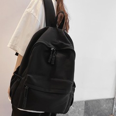 簡約書包女韓版初高中大學生校園時尚大容量背包男純色雙肩包批發