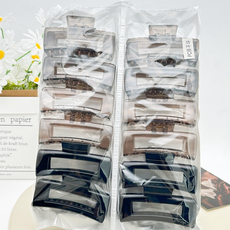 Pinza para el cabello de material PC irrompible color té con leche, pinza grande transparente color café para la parte posterior de la cabeza, accesorio para el cabello de supermercado a dos yuanes.