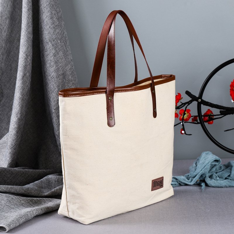 厂家手提女士休闲包棉布皮革手拎休闲挎包单色手提包批发印logo