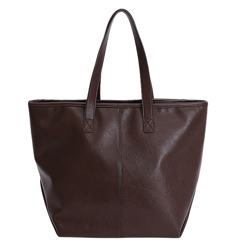 Bolsa de moda retro de gran capacidad para mujeres 2025 nueva simple versátil alta sensación de mochila de viaje diario
