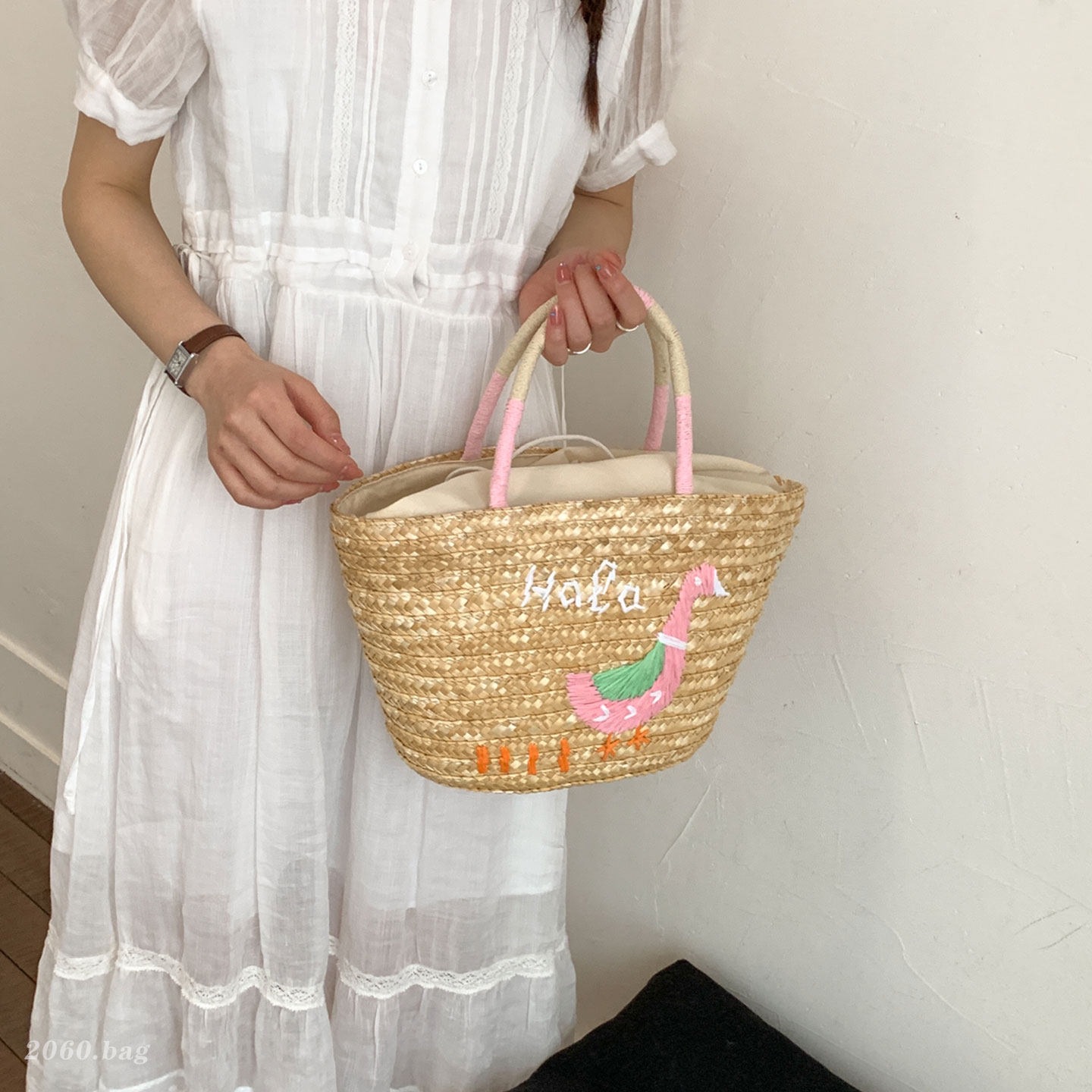 Bolsa de mano de mujer coco trenzado bolsa de moda de viento nuevo cubo hecho a mano de gran capacidad 2026 vacaciones de paja de hombro