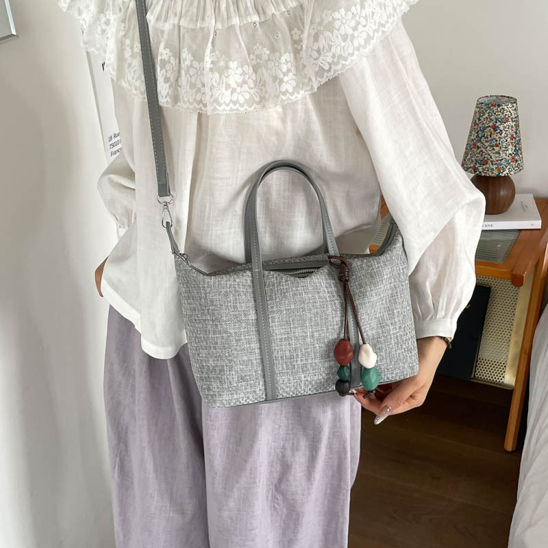Bolsa de mano de gran capacidad de viaje coreano para mujeres 2026 nueva moda de verano simple bolsa de hombro retro