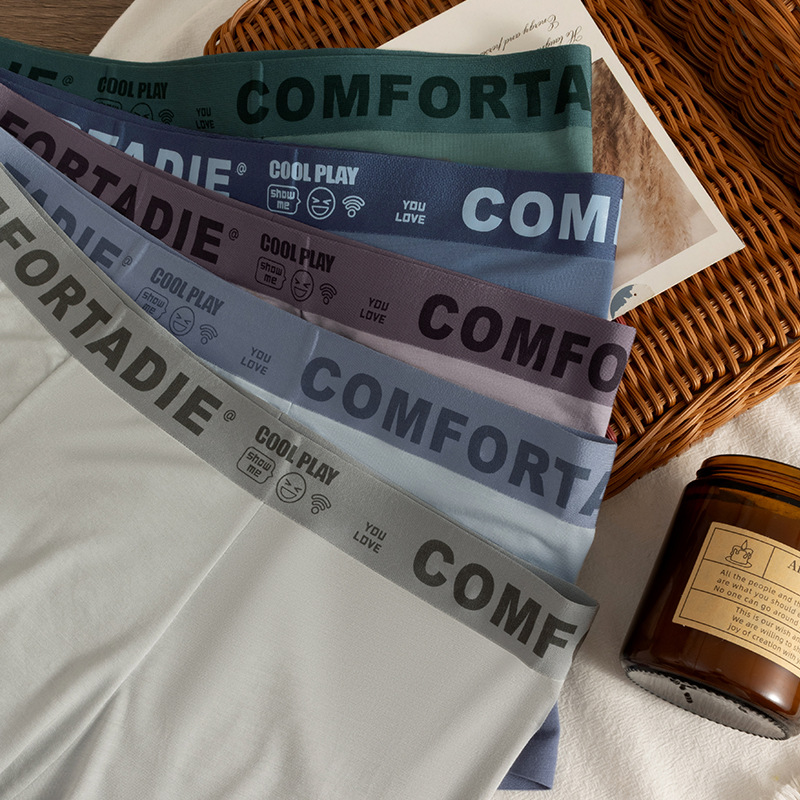 Hombre de alta gama algodón sin marcas pantalones interiores antibacterianos transpirables algodón entrepierna primavera y verano tendencia delgada juventud pantalones cortos de cuatro cuernos para chicos