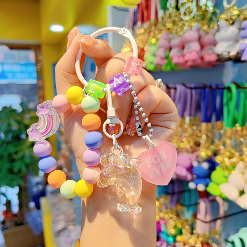 Nuevo acrílico delfín cuentas llavero bolsos creativos colgantes pequeños regalos frescos de cuentas de color al por mayor