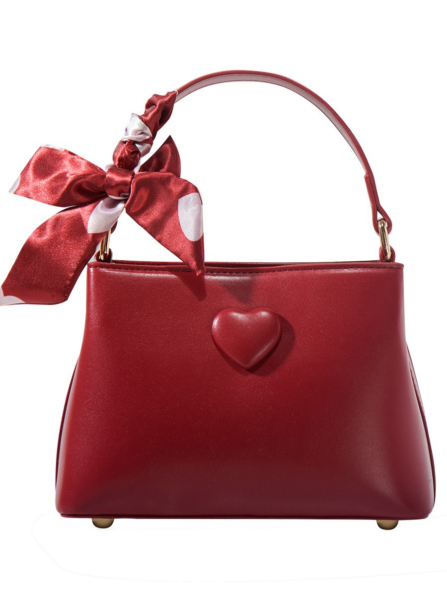 Bolso de boda de novia rojo portátil de nicho para mujer 2025 nuevo bolso de hombro de mensajero de viaje de amor de alta gama