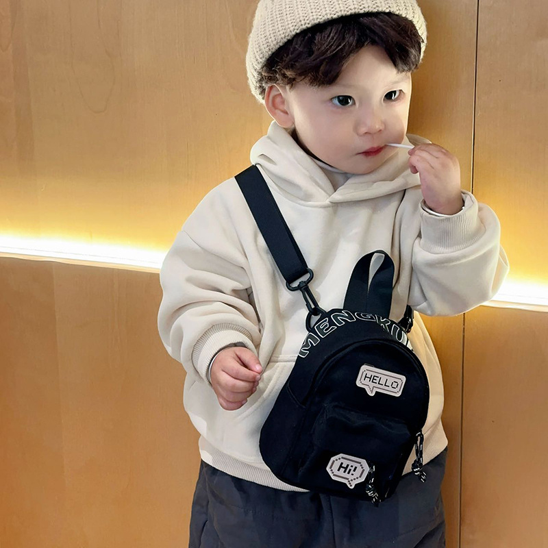 Mini bolso coreano para niños y niñas, letras extranjeras, insignia para bebés, bolso de cambio 2025, nuevo bolso para niños de comercio exterior
