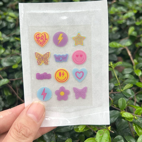 12 capsules with colorful patterns/paper plastic bags