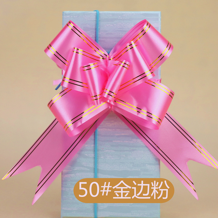 手拉花の結婚車の蝶結びの花の贈り物の包装は花の色の条を引き出して本のリボンのリボンの本を縛って賞状を縛ります。|undefined