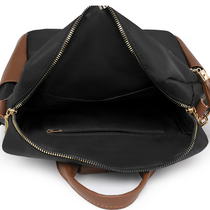 Mochila de tela de nailon nueva transfronteriza para mujer, bolso de viaje de ocio ligero y versátil de gran capacidad, mochila con flecos