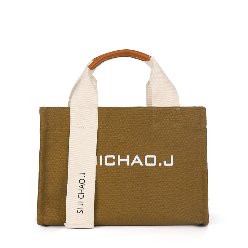 Bolsa personalizada al por mayor, bolso de mano retro de moda, estilo coreano nuevo, bolso de mano con letras impresas en color sólido para mujer