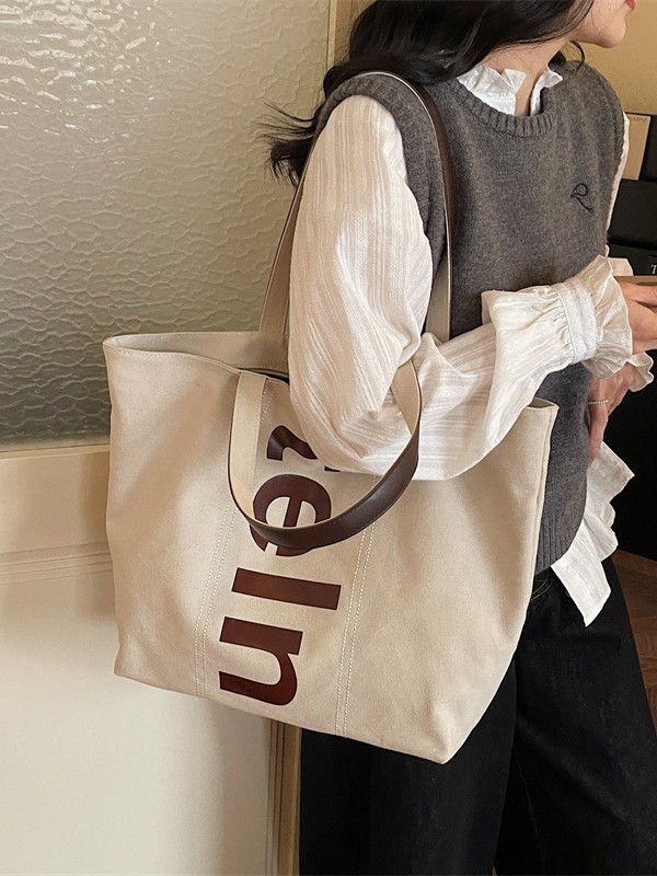 2026 nueva bolsa de hombro coreana versátil bolsa de lona casual para estudiantes universitarios de clase simple bolsa de viaje diario