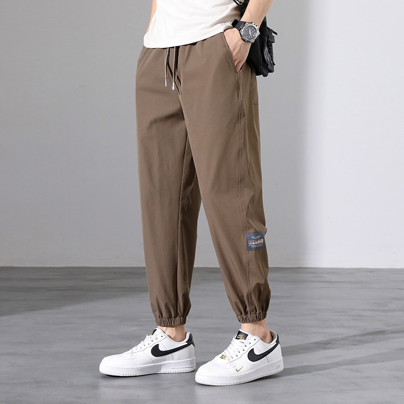 Pantalones deportivos para hombres pantalones casuales de tendencia sueltos de hielo de verano delgados nueve pantalones de patas pantalones para hombres al por mayor