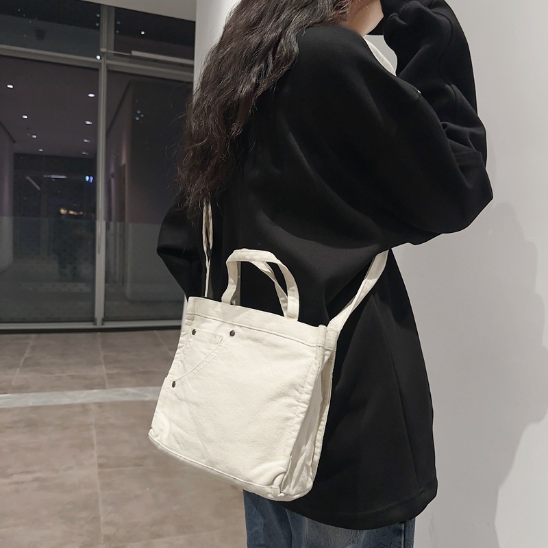 Bolso de lona lavado para mujer 2024 nuevo bolso de hombro minimalista literario de moda todo fósforo bolso diagonal portátil al por mayor