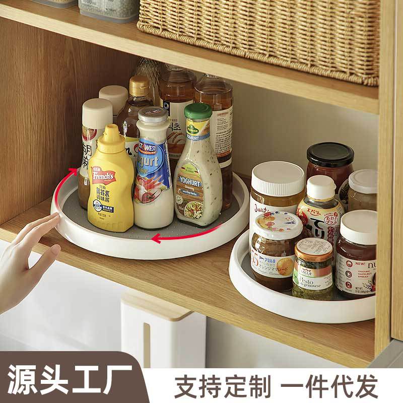 A rotatable spice rack for kitchen condiments, with a multi-functional storage box for oil, salt, sauce, and vinegar.