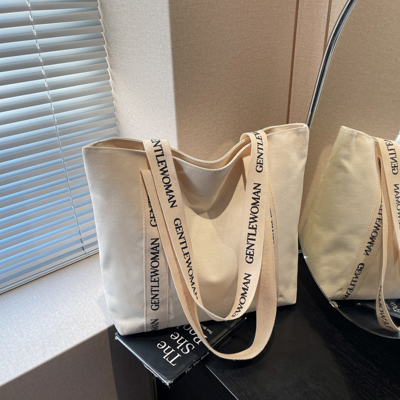 캔버스 가방 여성의 2025 새로운 트렌디 한 캐주얼 패션 손 어깨 가방 대형 용량 클래스 통근 토트 백