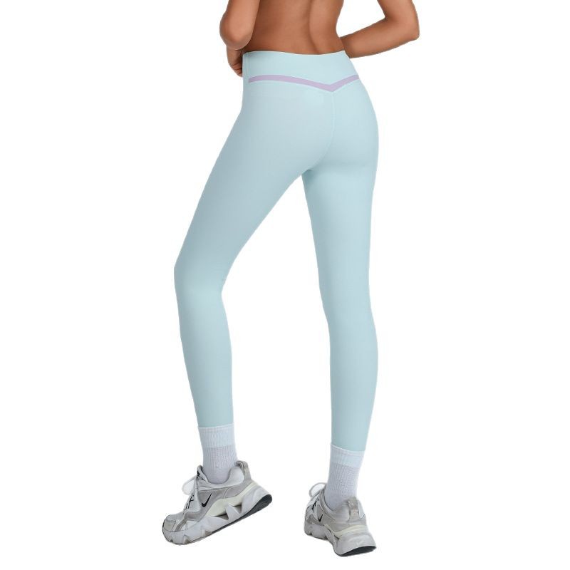 Nuevo estilo transfronterizo europeo y americano de contraste de color de cintura alta ajustada de secado rápido desnudo pantalones de yoga de nueve puntos para esculpir el cuerpo y levantar las caderas